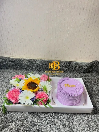 A clear, straight-on shot of the beautiful sunflower and cake tray for Mom.