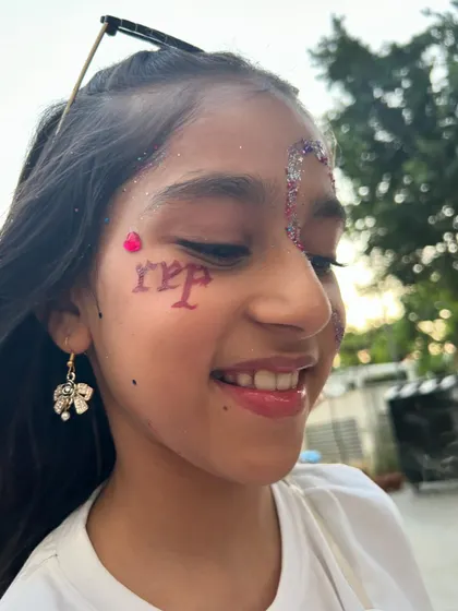 A close-up of the Taylor Swift "Rep" era inspired face art. It's all about the details and making the theme come alive.