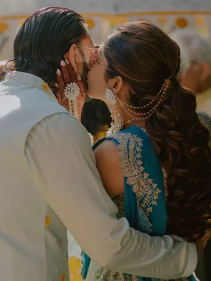 A stolen kiss during the Haldi ceremony. We are always looking for those fleeting moments of romance amidst the festive fun.