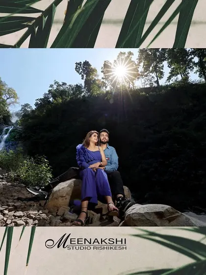 A couple enjoys a quiet moment by a waterfall, framed by lush greenery. I love finding these hidden spots in Rishikesh to create truly special pre-wedding photos.