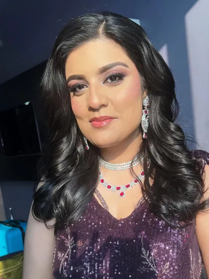 A sun-kissed shot of this gorgeous cocktail glam, highlighting the radiant skin and shimmering eyeshadow.