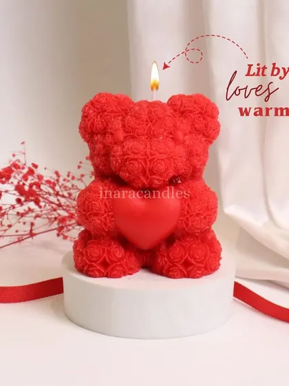 Lit by love's warmth. Our adorable teddy bear candle, holding a heart, is a cute and cuddly way to express your affection. A perfect Valentine's gift.