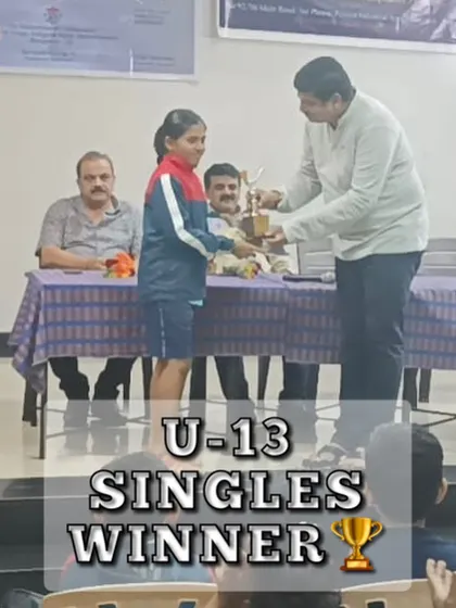 A young champion receiving her trophy for winning the U-13 Singles tournament. We nurture talent from the very beginning.