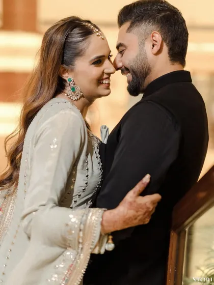Sometimes, the most powerful stories are told in the simplest glances. This close-up captures the pure happiness and affection between a couple, a candid moment that is both beautiful and authentic.