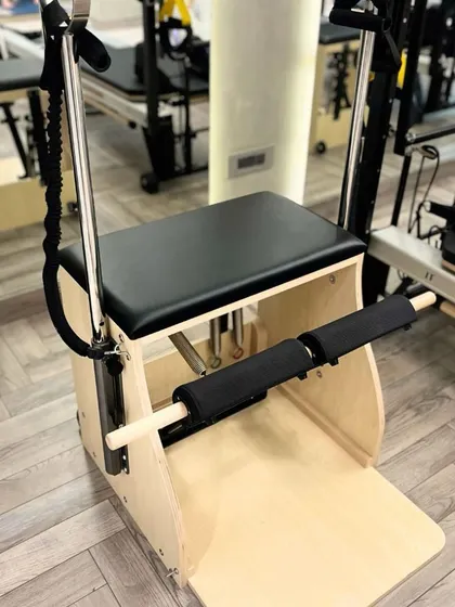 A close up of the Wunda Chair, one of Joseph Pilates' original inventions. It's a versatile tool for a challenging, full body workout.