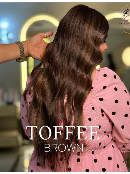 My hand running through the hair shows its soft texture and the beautiful way the toffee brown highlights catch the light.