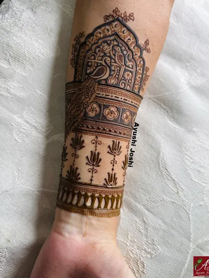 The full arm band for the baby shower design, with a peacock motif above a pattern of blooming lotuses.