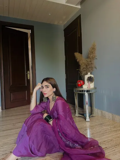 Another seated pose, looking directly at the camera. The color of this suit is just stunning.