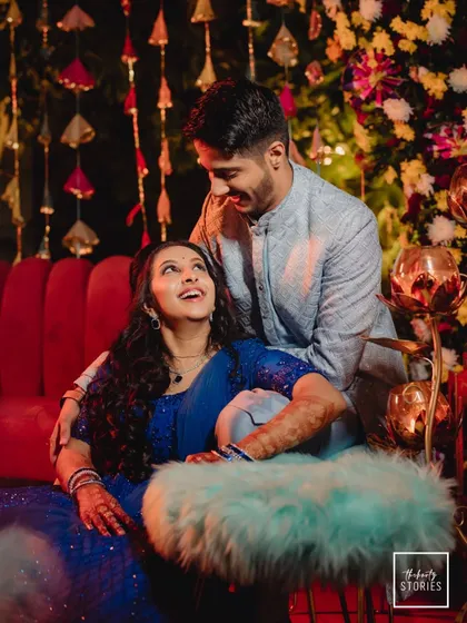 A sweet, candid moment between the couple on their Sangeet night. Their adoring gazes and happy smiles perfectly capture their love.