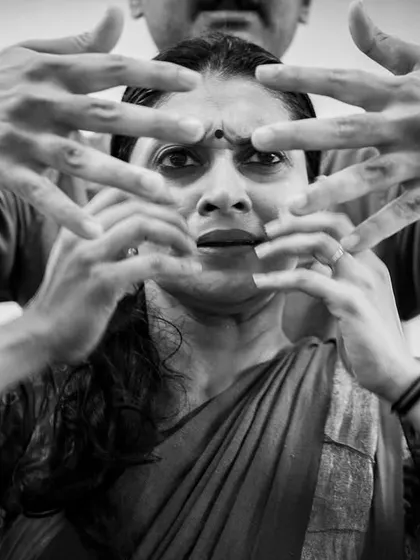 This image from an *Abandhana* rehearsal captures the feeling of being trapped or silenced, a central theme in the poetry of the Therīgāthā.
