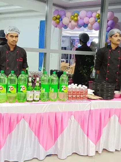 A dedicated welcome drink and juice counter with a fun pink and white theme, perfect for parties.