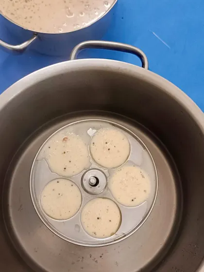We made Rava Idlis while exploring history. The children learned how this dish was invented by MTR during a rice shortage in WWII, connecting a hands-on cooking session with a real-world historical event.