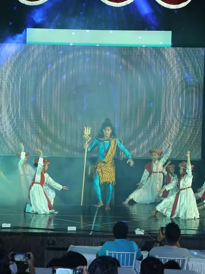 Smoke and dramatic lighting add to the atmosphere of the Shiv prayer dance, creating a memorable visual for the audience.