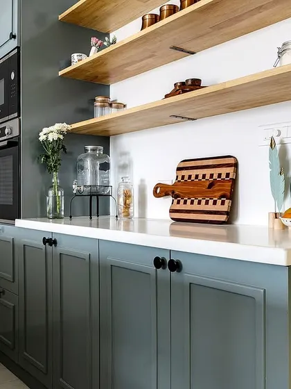 Close-up of the open shelving, styled with everyday essentials and decorative items.