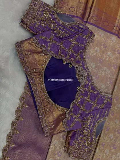 The back of the purple blouse features a beautiful jaal pattern on a sheer panel.