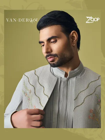 The Vanderphool collection blends sophistication with a touch of floral flair. This grey jacket features delicate, wavy embroidery, adding a subtle yet artistic touch.