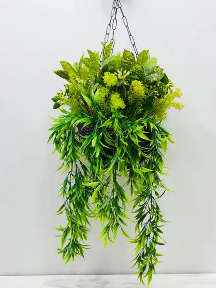 A monochromatic hanging basket featuring various shades of green foliage and textures for a sophisticated, natural look.