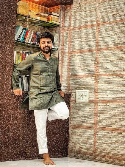 A simple photo in my home, dressed in traditional Indian wear. This is me, grounded in my roots, surrounded by my books and my space.