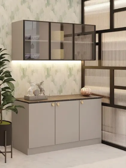 This modern crockery unit is paired with a geometric fluted glass partition. The simple grey cabinets and dark countertop are elevated by the interesting textures and soft wallpaper in the background.