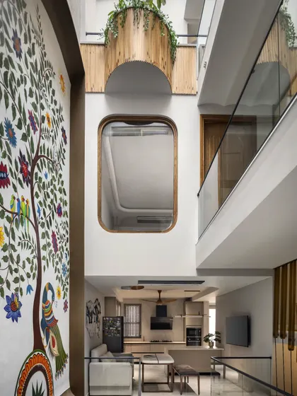The core idea for the Slender House was to punctuate the narrow volume with staggered cut-outs and skylights. This view from the top of the courtyard shows how light filters down, filling the home with vitality and a sense of openness.
