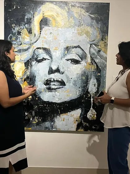 An art discussion happening in front of my monochrome Marilyn Monroe painting. I love when my art sparks conversation and connection.