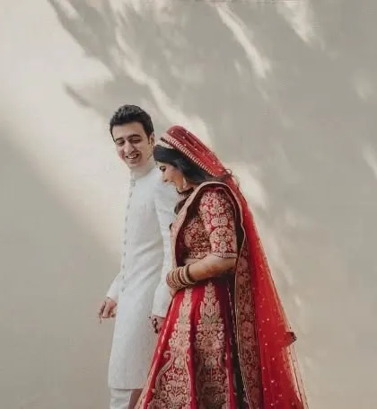 A simple, artistic shot of the couple walking together, with beautiful light and shadow play.