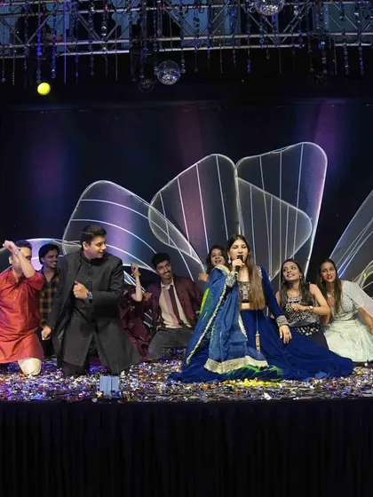 A wide shot of a group performance, with me in the center guiding the choreography and keeping the energy high.