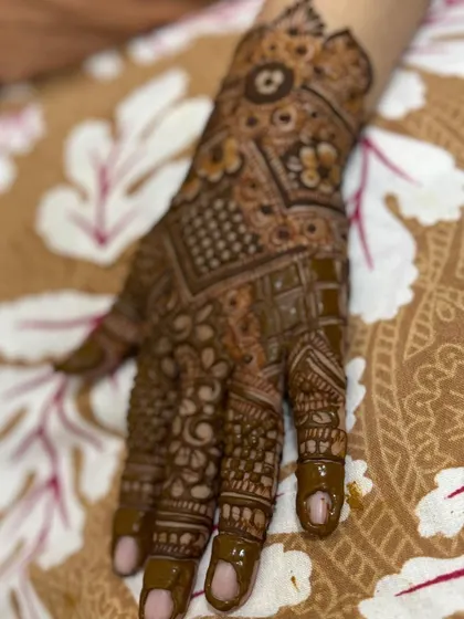 A view of the full back-hand design, showcasing the intricate patchwork of different patterns.