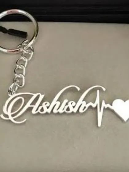 A custom name keychain designed with a heartbeat and heart symbol. This makes for a very personal and meaningful small gift.
