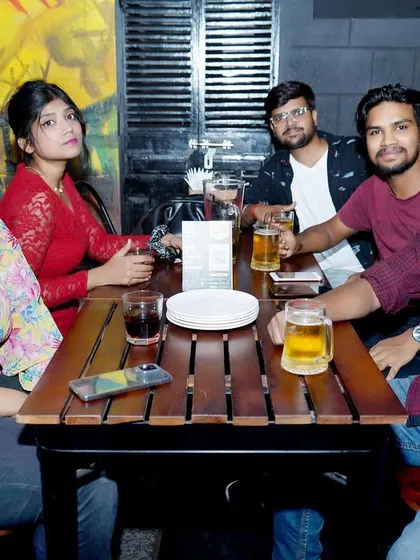 A group enjoying their drinks and the music. I can provide a more relaxed, background vibe for the earlier parts of an evening before turning up the energy for the dance floor.
