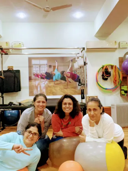 Posing with the stability balls after a challenging class. We always find a reason to smile.