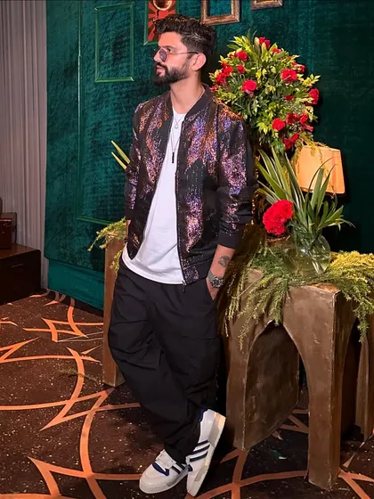 The same edgy look in color. The jacket has a great shine that works well for evening events.