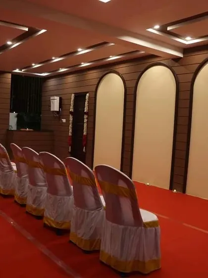 The meditation hall at our Bangalore centre, set up with chairs for an event. We ensure our spaces are comfortable and accessible for all participants.