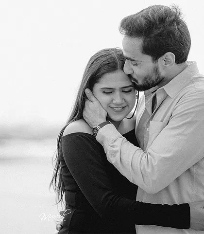 A tender black and white portrait, filled with emotion and intimacy. This classic style emphasizes the connection between the couple.