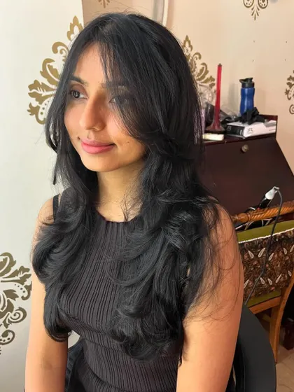 Smitha's hair has incredible volume and movement with this cut.