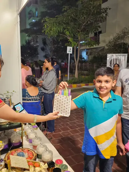 A family stopping by the stall. It's a pleasure to help people find the perfect scent for their home.