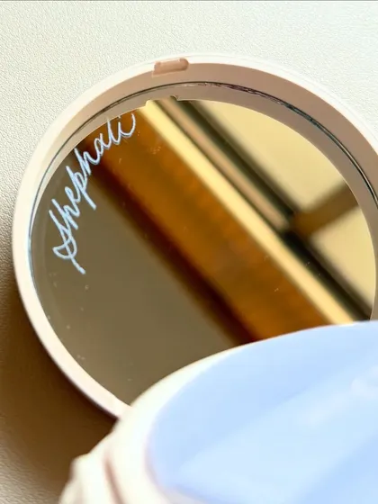 Engraving on the mirror of a makeup compact. It's one of the most satisfying surfaces to work on, and the result is a stunningly personal and private message.