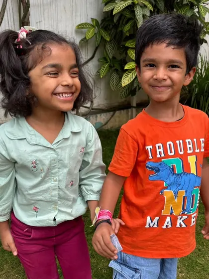 A happy moment between two friends. Our mixed-age environment allows for beautiful friendships to form, where older children mentor younger ones.