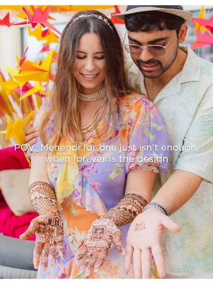 "Mehendi for one just isn't enough, when forever is the design." The couple showing off their beautiful henna, a symbol of their shared journey.