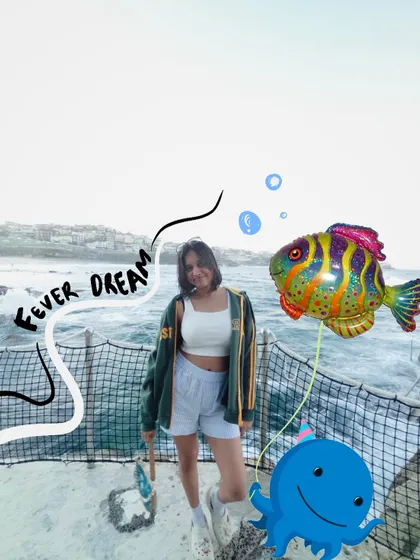 A fever dream by the ocean. I added some quirky fish and octopus balloon doodles to make this photo feel surreal and fun.