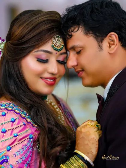 A close-up of a couple's happy and intimate moment. The focus is on their genuine smiles and the emotional connection between them.