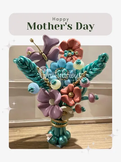 This intricate balloon bouquet was designed for Mother's Day. I sculpted a variety of flowers and a butterfly from balloons to create a lasting arrangement that is as unique and beautiful as she is.