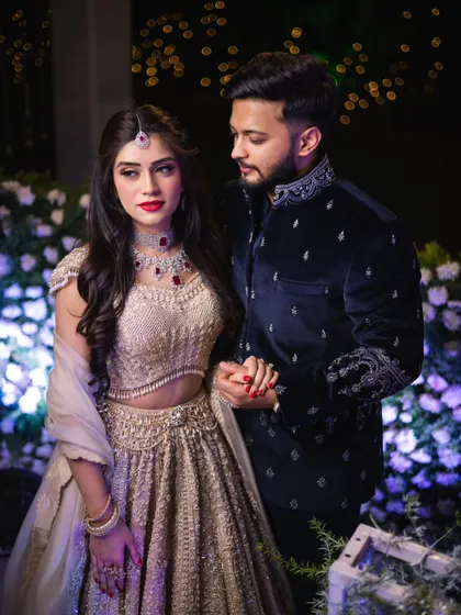 The couple looking poised and elegant. Mahima's makeup is classic and sophisticated, a perfect choice for a formal engagement celebration.