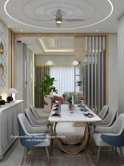 An angled view showing the relationship between the living and dining areas, connected by a wooden-paneled archway.