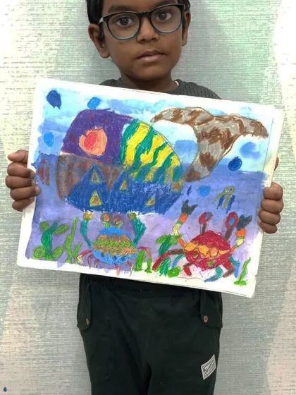 An imaginative underwater scene created by one of our sensory art students. The use of color and shape to depict the whale and crabs is wonderfully creative.