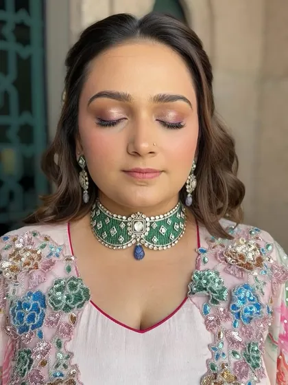 A close-up of the eye makeup for the carnival look. The soft metallic rose eyeshadow is blended beautifully to create a shimmery, eye-catching effect.