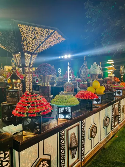 A display of intricately cut and arranged fruits.