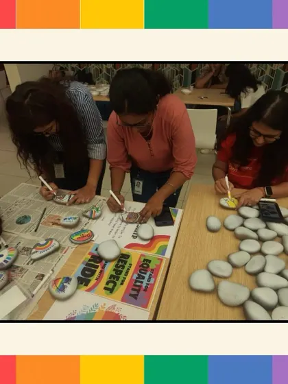 A view of the pebble painting station, where employees are busy creating their unique designs to show support for the LGBTQ+ community.