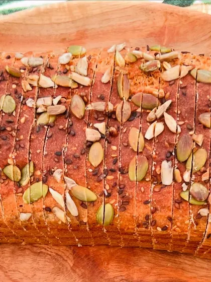 A beautiful top-down view of a freshly sliced loaf. This bread is perfect for anyone looking for a clean, plant-based protein source that is both delicious and versatile.