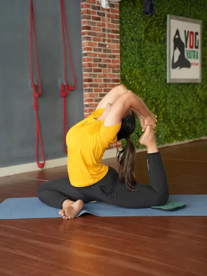 Eka Pada Rajakapotasana, or One-Legged King Pigeon Pose. This advanced backbend requires open hips, flexible quadriceps, and a very mobile spine. It's a pose that takes years of patient practice.